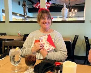 The Chateau Resident Pam Zastrow poses for a picture on Valentine's Day